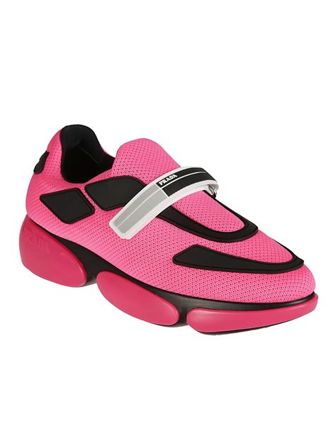 pink and white prada sneakers.